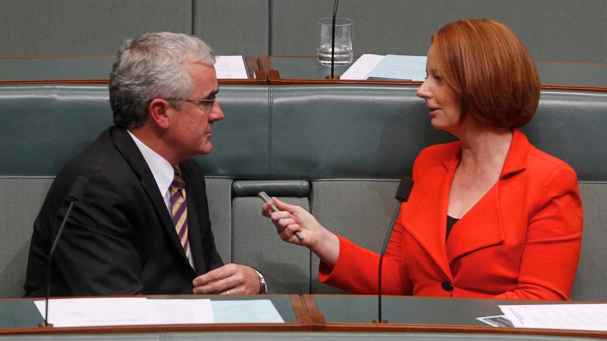 Independent MP Andrew Wilkie and then prime minister Julia Gillard in 2011. Picture: Andrew Meares