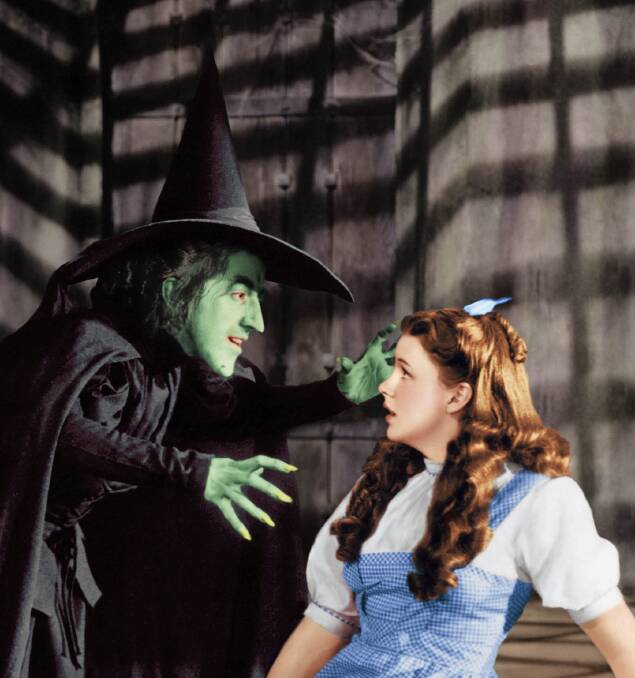 Margaret Hamilton as the Wicked Witch of the West, left, looming over Judy Garland as Dorothy in The Wizard of Oz. Picture: Supplied