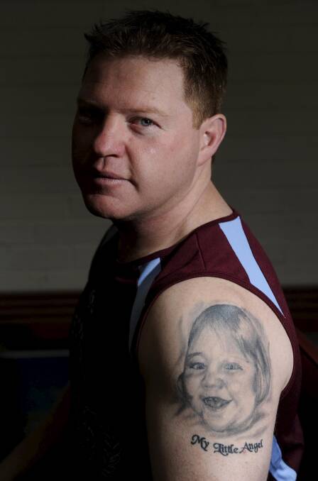  Craig Robberds in 2011 showing the tattoo of his daughter Gabby. Picture: Lannon Harley.