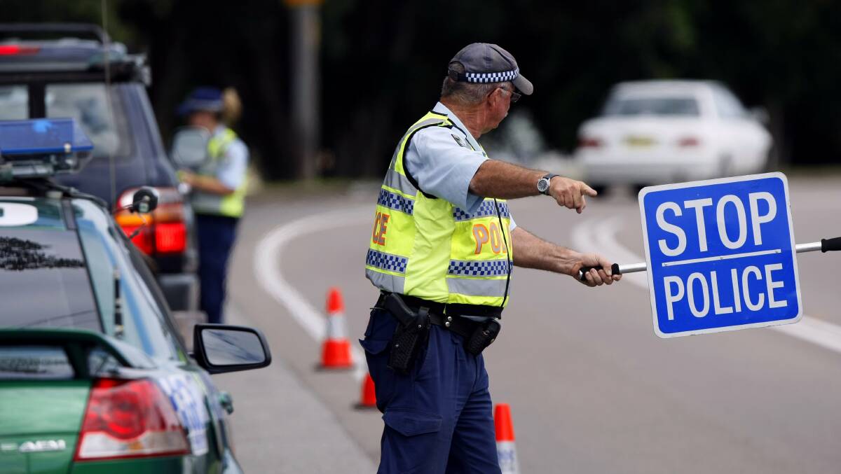 A random breath testing stop run by two NSW highway patrol police officers. Photo: Max Mason-Hubers.