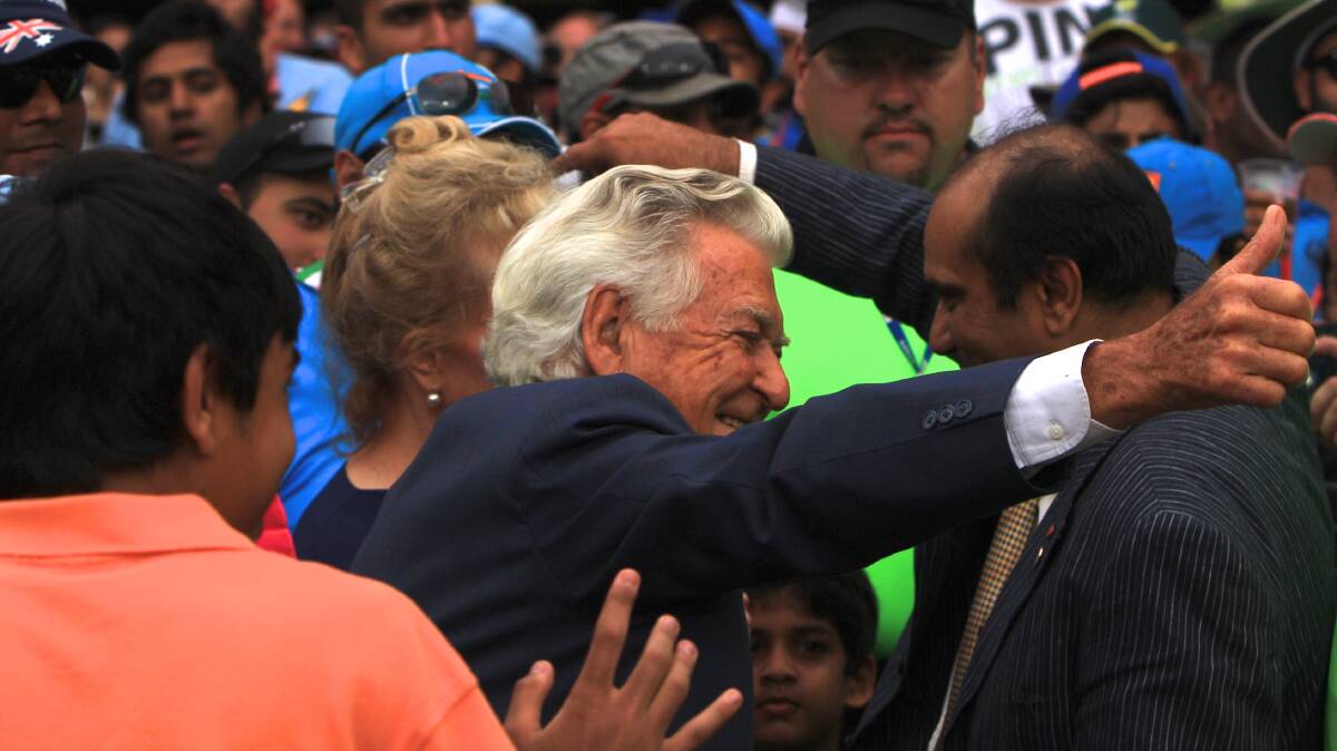 Bob Hawke was a crowd favourite at the SCG after finishing off a beer in 2012. Picture: Steve Christo