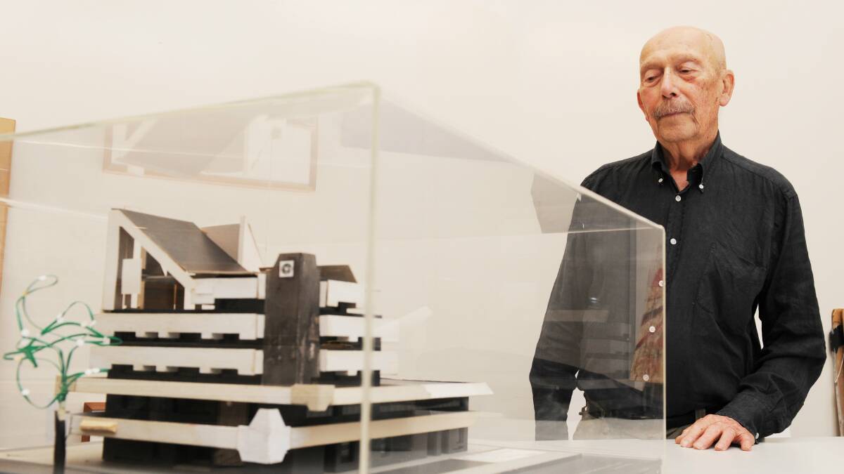 Architect Enrico Taglietti with a model of the iconic Center Cinema building in 2012. Picture: Rohan Thomson