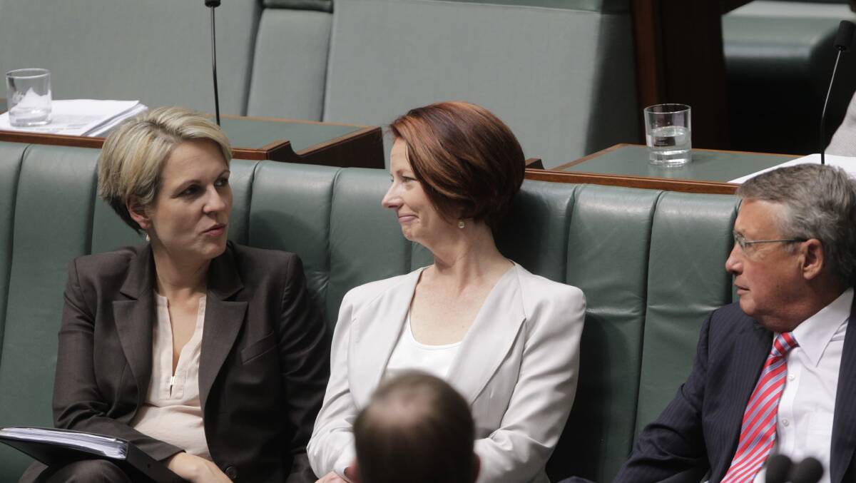 Tanya Plibersek and Julia Gillard during question time in parliament in 2012. Picture: Andrew Meares