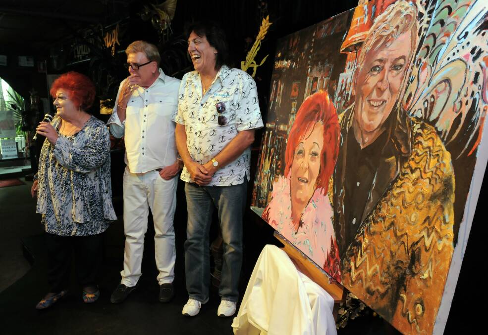 The 2013 unveiling of a "Faces of Canberra" portrait by Barbara van der Linden of local theatre identities, Coralie Wood, left and Charles Oliver, centre, by entertainer Jon English, right. Picture: Graham Tidy, The Canberra Times.
