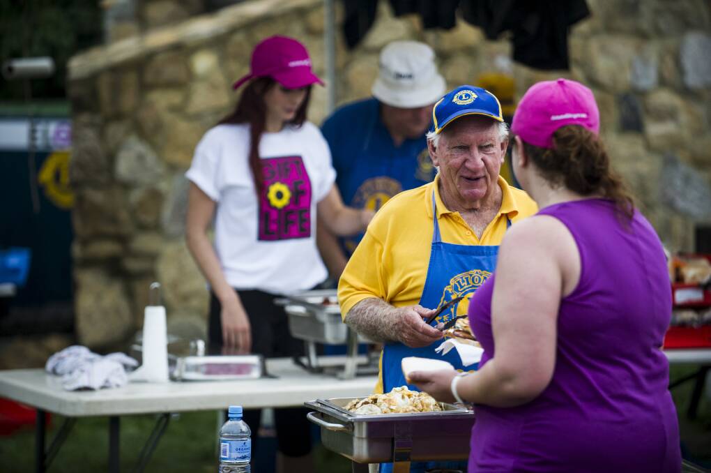 Belconnen Lions Club members manning the barbecue at the DonateLife walk in 2013. Picture: Rohan Thomson.