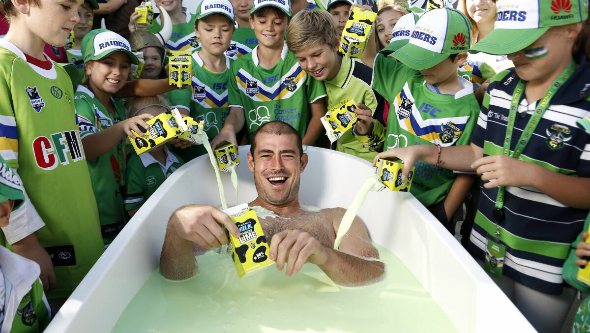 Up the milk: Former Canberra Raiders captain Terry Campese bleeds green - and bathes in it too. Picture: Jeffrey Chan