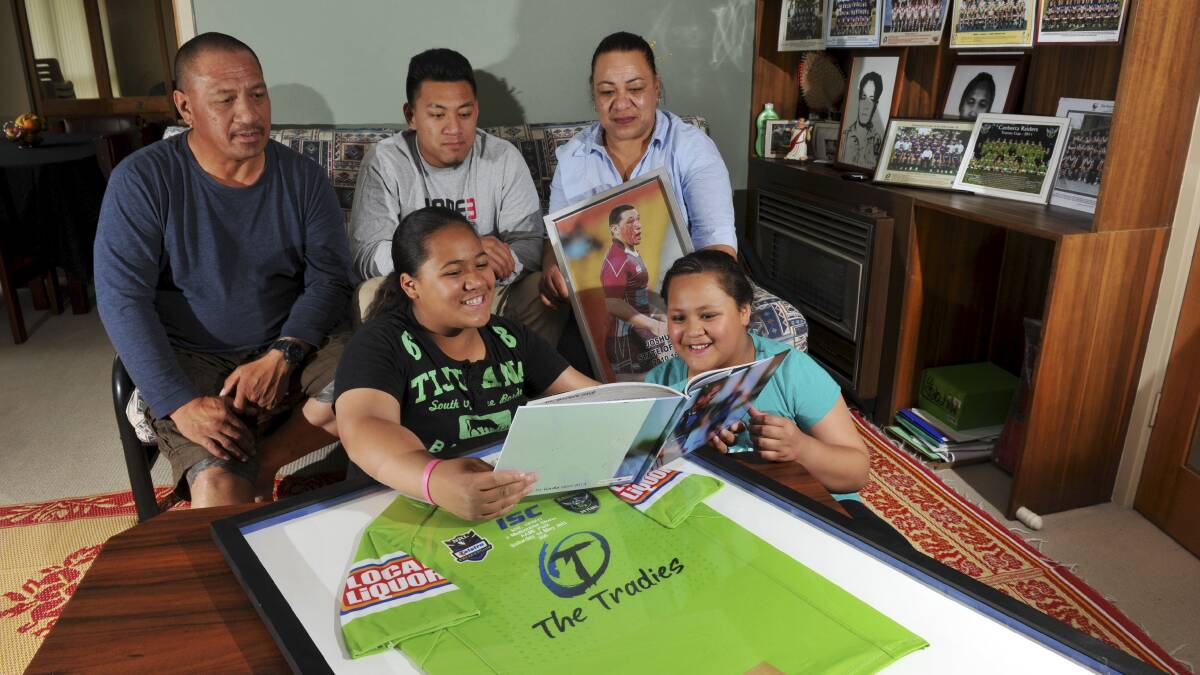 Sport. Canberra Raiders and Kangaroos representative player, Josh
Papalii's family at their Weetangerra home, will gather to watch him
play in the World Cup match on Saturday on TV. L to R rear, father
Patrick, brother, John, mother Luama and sisters, Crystal, left and
Tina. November 28th 2013 Canberra Times Photograph by Graham Tidy. photo.JPG