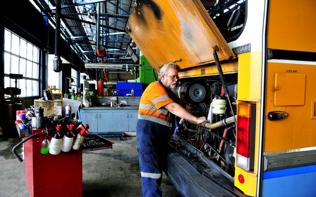 ACTION bus mechanic fitter Tom Bermingham works on one of the diesel Renault buses due for retirement. Picture: Melissa Adams 