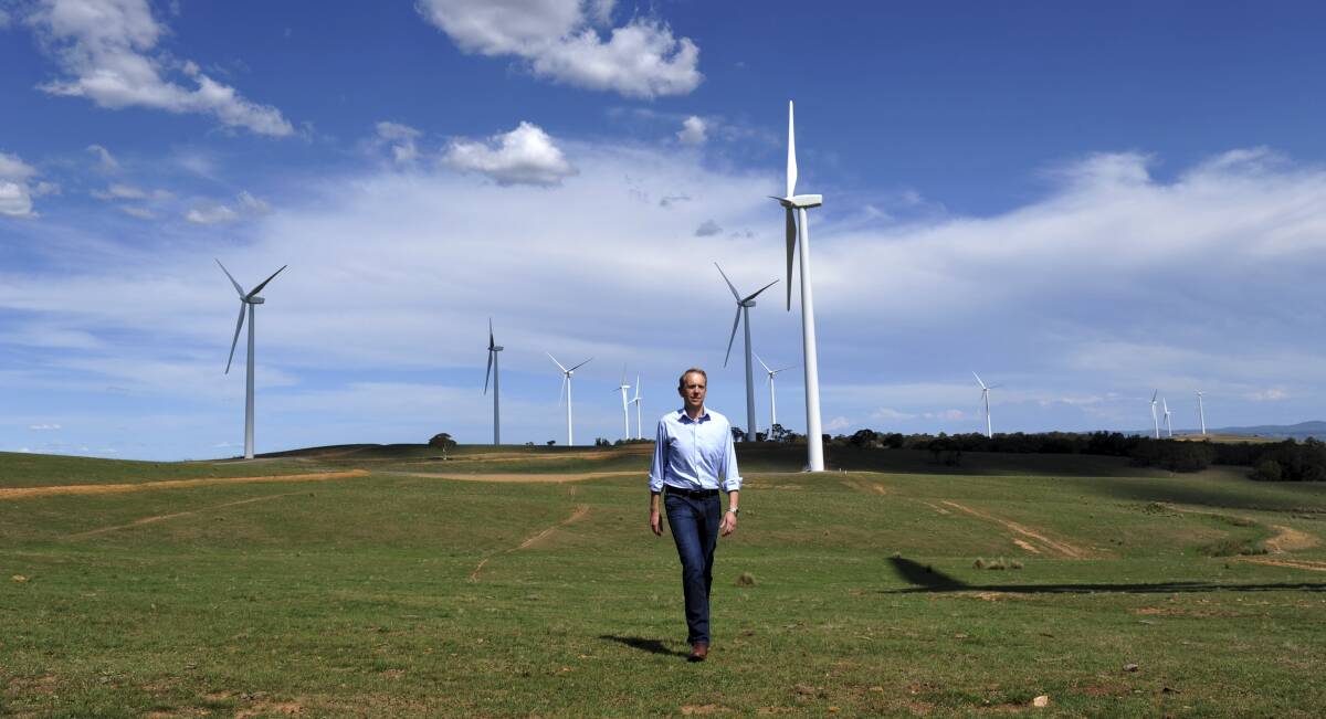 Former ACT deputy chief minister Simon Corbell toured the Gunning wind farm facility in 2014, established through Canberra's reverse-auction process. Photo by Graham Tidy