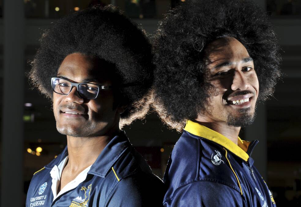 The fro bros: Henry Speight, left, and Joe Tomane had a cult following when they were Brumbies teammates. Speight raised more than $30,000 when he shaved his afro for charity. Picture: Graham Tidy