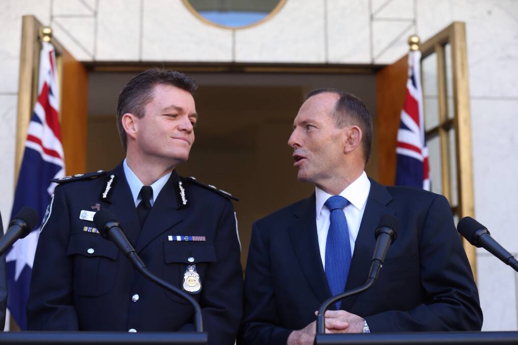 Gym buddies: Then prime minister Tony Abbott (right) announces Andrew Colvin will be the AFP commissioner in October 2014. Picture: Andrew Meares