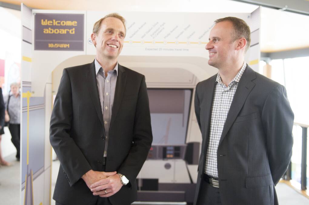 Former Capital Metro Minister Simon Corbell, pictured with Chief Minister Andrew Barr in 2016, has been handpicked to sit on a committee tasked with overseeing the government's transition to a zero-emissions bus fleet. Picture: Jay Cronan