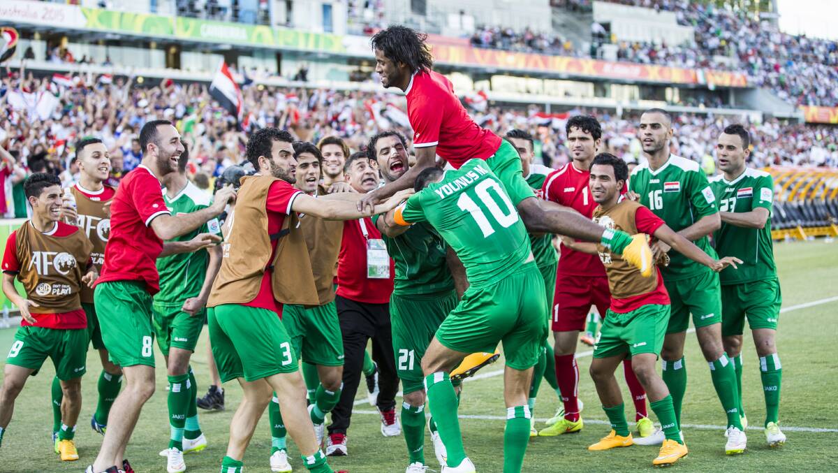 The Iraq team celebrate after Younus Mahmood of Iraq scores in extra time in the Asian Cup. Picture: Matt Bedford