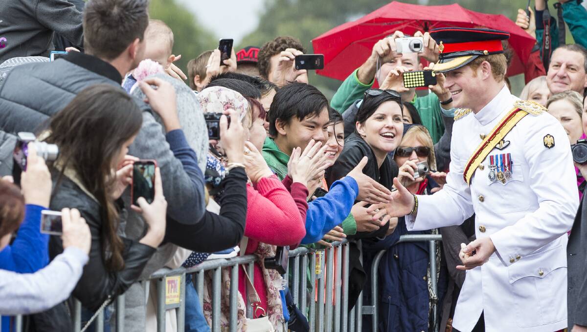 Prince Harry greets the crowd during a visit to the Australian War Memorial in Canberra on April 6, 2015. Picture: Matt Bedford.