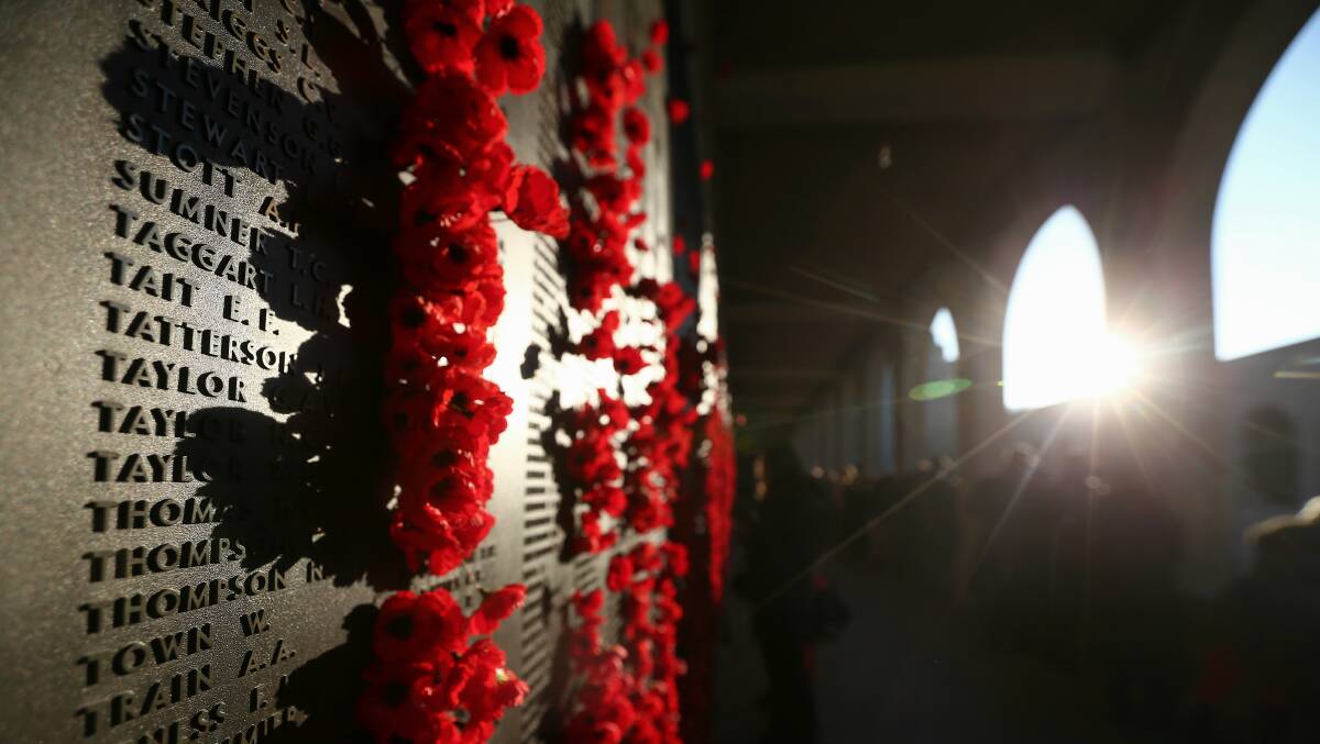 Poppies placed on the Roll of Honour at the Australian War Memorial in Canberra. Photo: Alex Ellinghausen