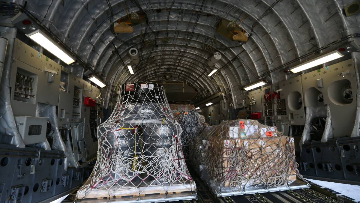 Supplies loaded on a RAAF C-17 Globemaster bound for Fiji after it was hit by Tropical Cyclone Winston, at RAAF Base Richmond in New South Wales on Sunday, March 13, 2016. Picture: Alex Ellinghausen