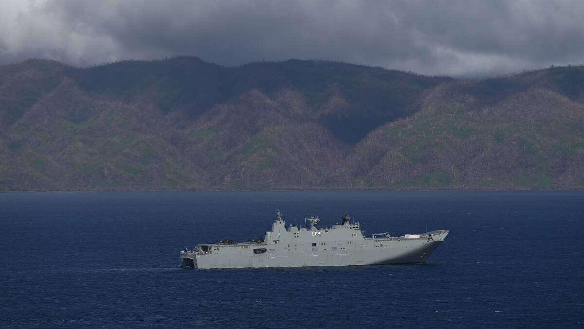 The HMAS Canberra off Fiji to assist with recovery after it was affected by Tropical Cyclone Winston. Picture: Alex Ellinghausen