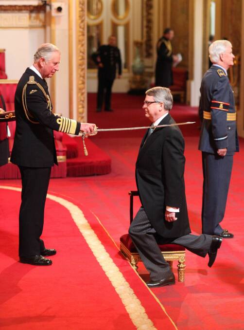 Australian Lynton Crosby is made a Knight Bachelor of the British Empire by the Prince of Wales in 2016 for service to British politics. Dubbed the 'Wizard of Oz', Crosby is now behind Boris Johnson's push for the prime ministership. Picture: Anthony Devlin/PA 