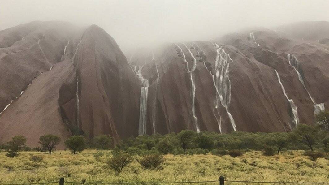 A massive Christmas night storm in 2016 sparked flash floods at Uluru. Picture: Parks Australia