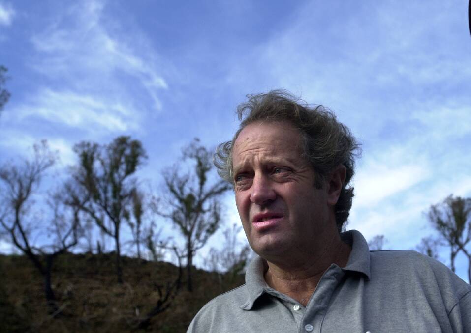 Wayne West in the wake of the 2003 bushfires. Picture: Andrew Campbell