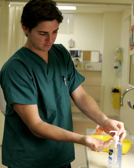 Dr Scott Flannagan washes his hands as a hygiene precaution to protect against swine flu in 2009. Picture: Natalie Grono.