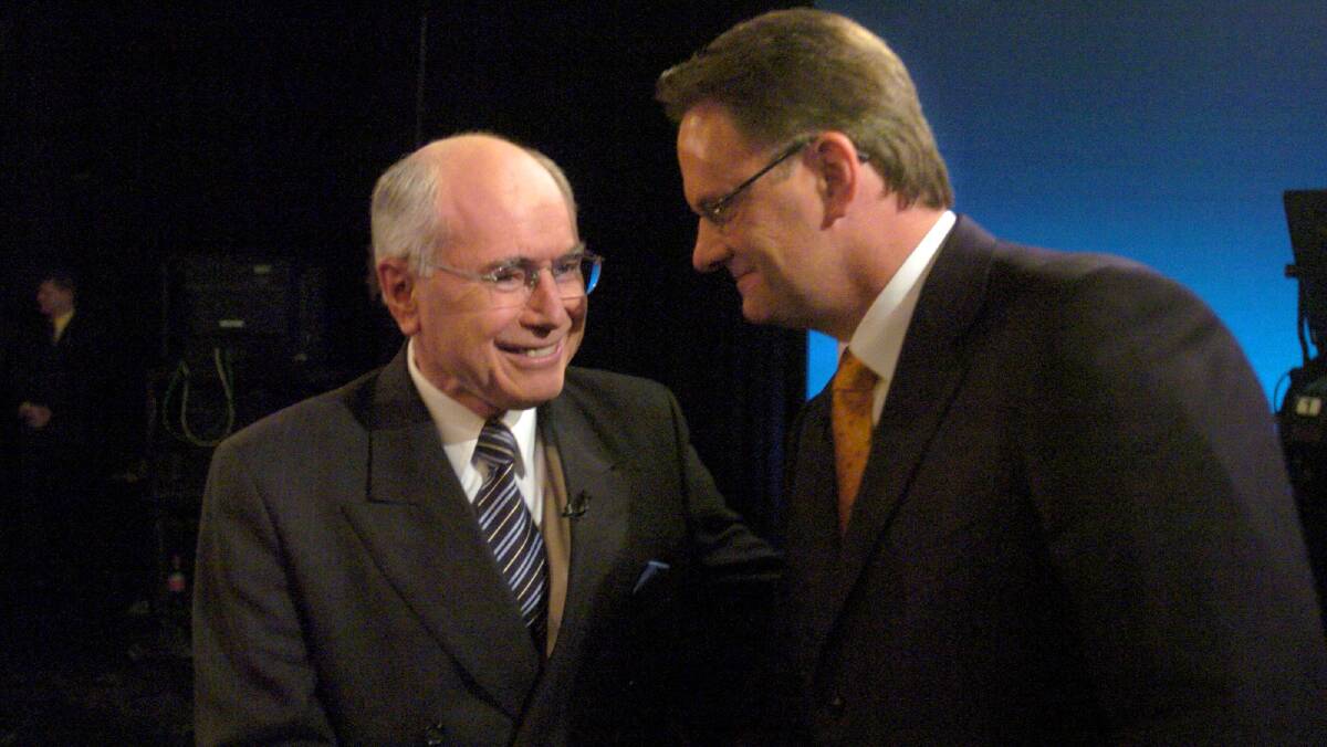 Former prime minister John Howard, left, spent his 2004 campaign playing to uncertainties about Labor leader Mark Latham. Photo: AAP