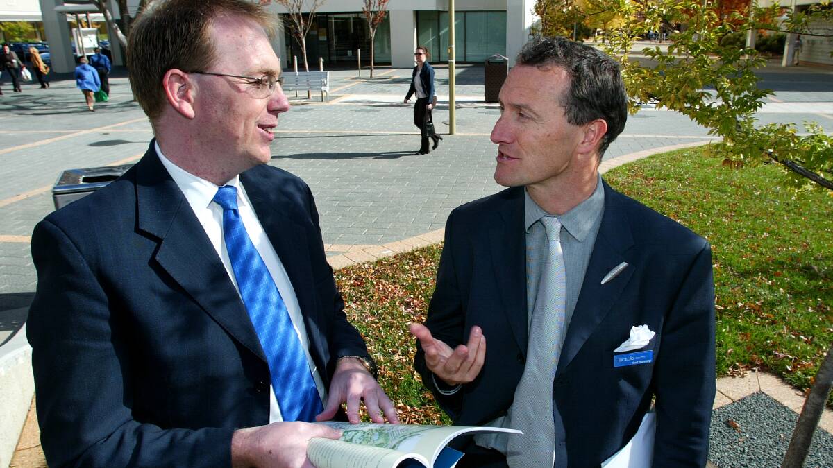 Former ACT planning minister Simon Corbell and Neil Savery at the launch of the New Woden Plaza development. Picture: Ben MacMahon
