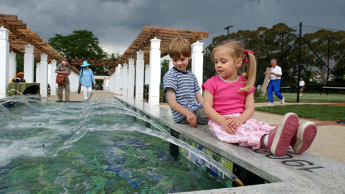Back in December, 2004, Callum Taylor, then 6, and sister Olivia, then 3, attended the opening of the reconstructed Old Parliament House Rose Gardens. Picture: Gary Schafer