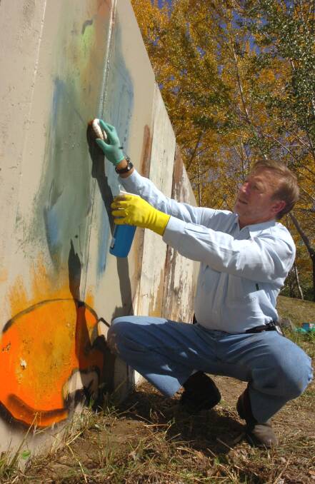 Steve Pratt scrubbing out the offending graffiti in 2007. Picture: Richard Briggs.
