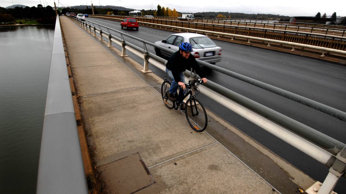 The Canberra way - cycling on Commonwealth Avenue bridge. File picture: Marina Neil