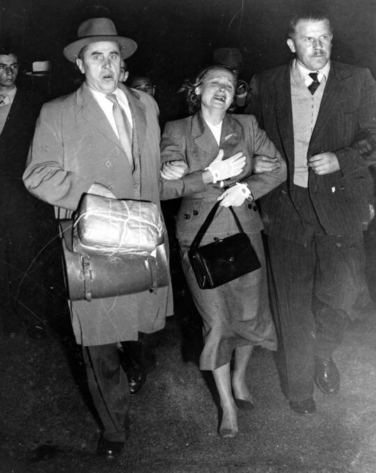 Mrs Petrov at Mascot Airport escorted by two Soviet officals. Picture: William Carty - courtesy ScreenSound Australia.