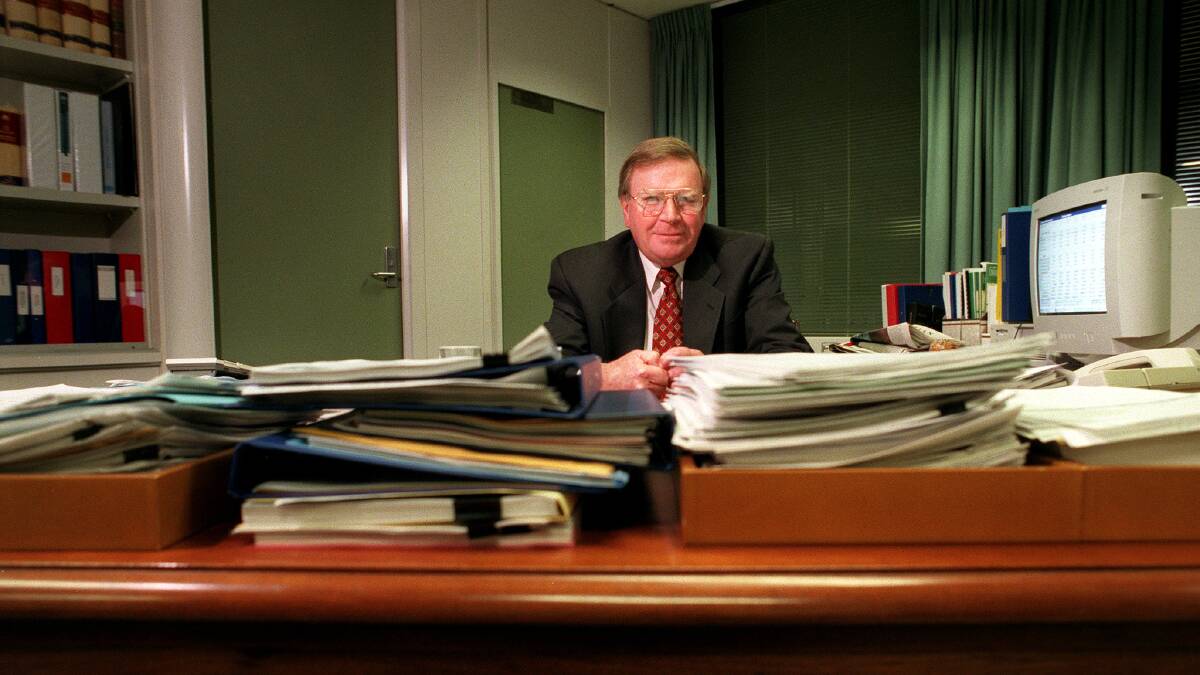 Ted Evans at his desk during his time as Treasury secretary. Picture: Paul Harris