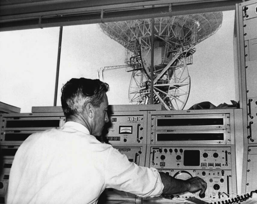 The dish at Honeysuckle Creek is seen through the window of the tracking station. Picture: Fairfax Archives