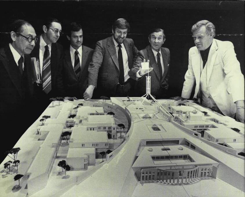 I.M Pei, far left, and Gareth Evans, fourth from left, with a model of the winning design for new Parliament House. Picture: Kenneth Stevens