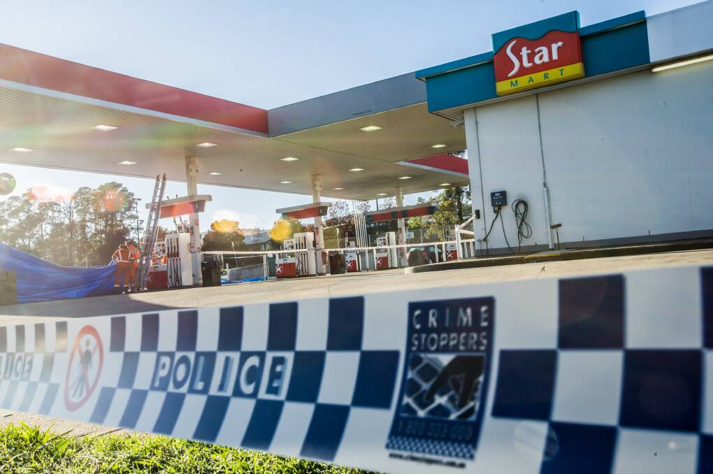 NSW police officers and SES personnel attend the scene of a fatal stabbing at the Queanbeyan Caltex service station in 2017. Picture: Karleen Minney