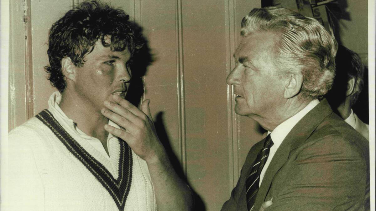 Greg Ritchie talks to Bob Hawke after being hit with a cricket ball during a match in 1984.