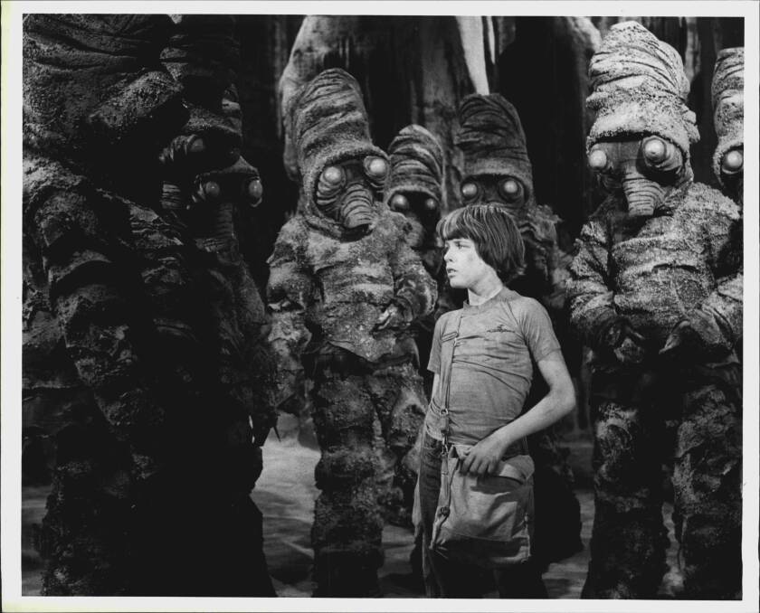  Simon (Rodney Bell) with the rock creatures, the Nyols, in The Nargun and the Stars. Picture: Australian Broadcasting Corporation. 