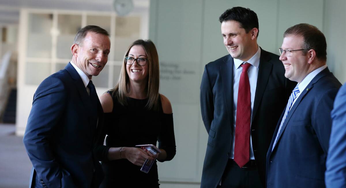 Liberal Party federal director Andrew Hirst (centre), with former prime minister Tony Abbott, is being credited with the Coalition's election win. Picture: Alex Ellinghausen
