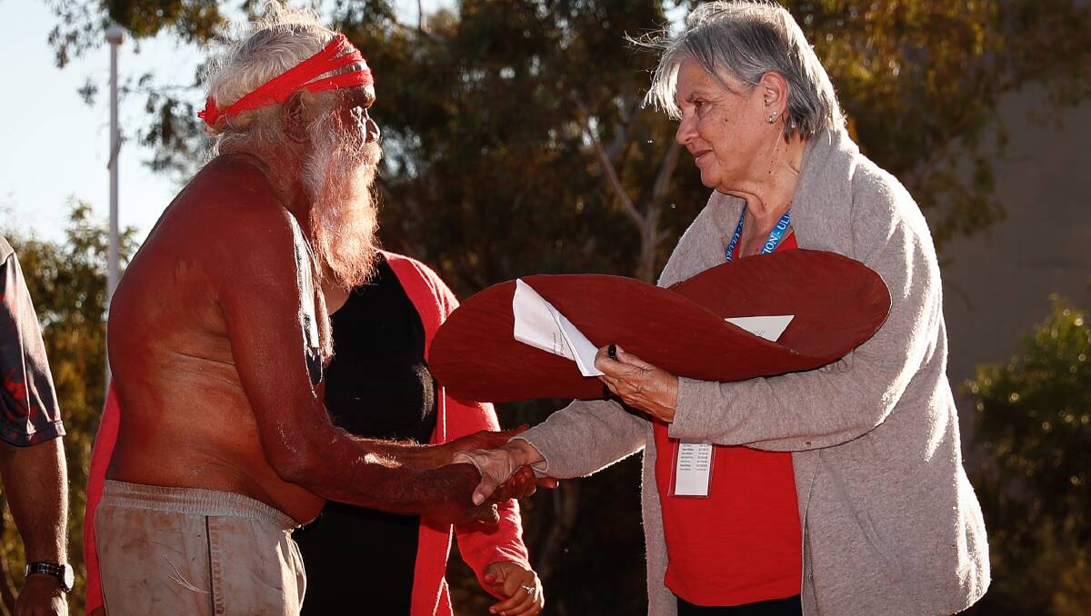 Mutitjulu elder Rolley Mintuma and Pat Anderson from the Referendum Council with a piti holding the Uluru Statement from the Heart in May 2017. Picture: Alex Ellinghausen
