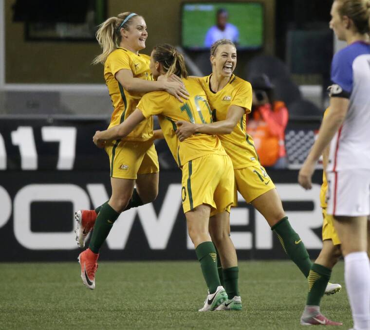 Jumping for joy: Ellie Carpenter's Matildas and the Socceroos are Canberra-bound. Picture: AP