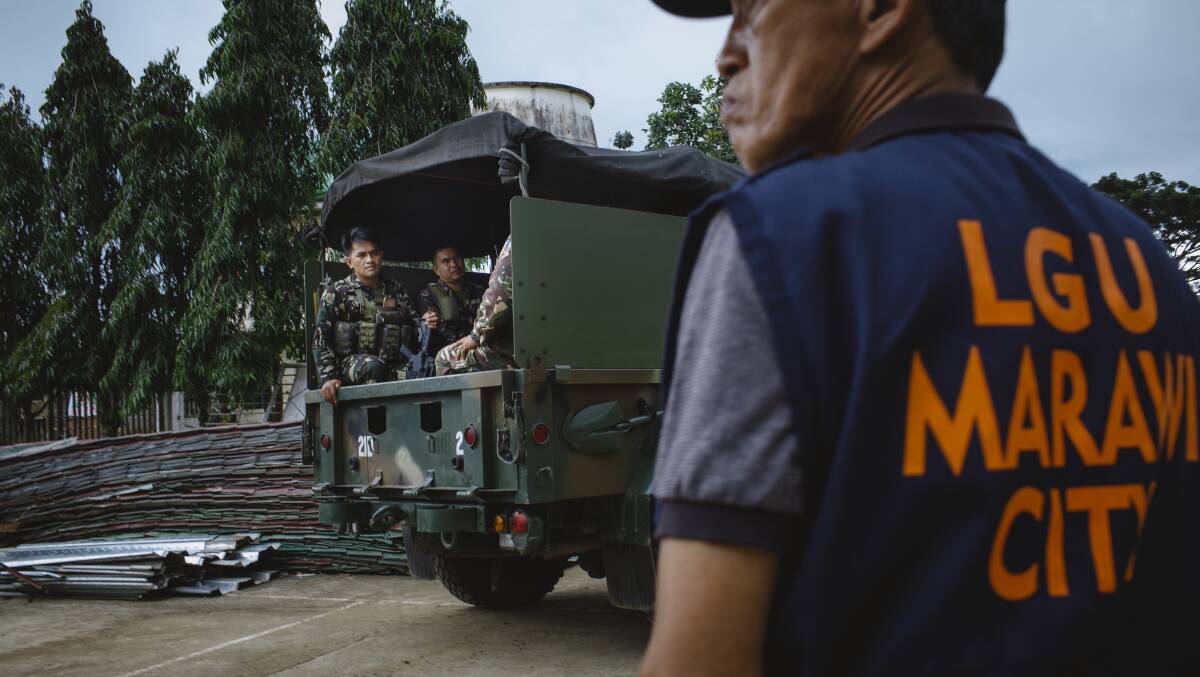 Members of the Philippines Army 103rd brigade roll out in Marawi City. Picture: Sitthixay Ditthavong