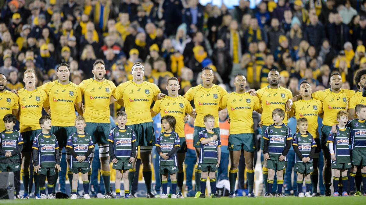 Members of the Wallabies sing the national anthem before a game.
Photo: Sitthixay Ditthavong