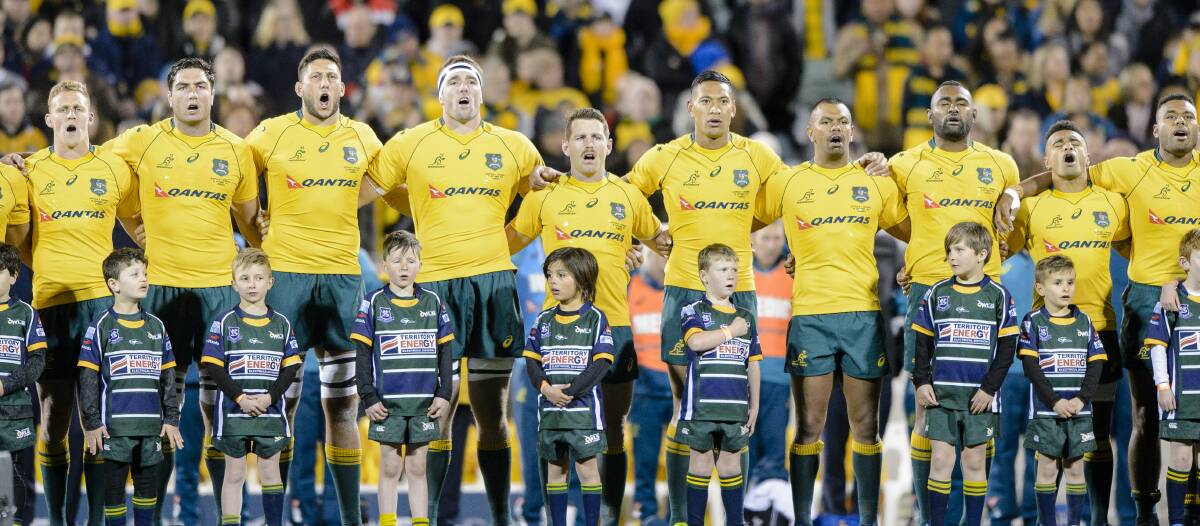 Wallabies players sing the national anthem ahead of a match in 2018. Picture: Sitthixay Ditthavong