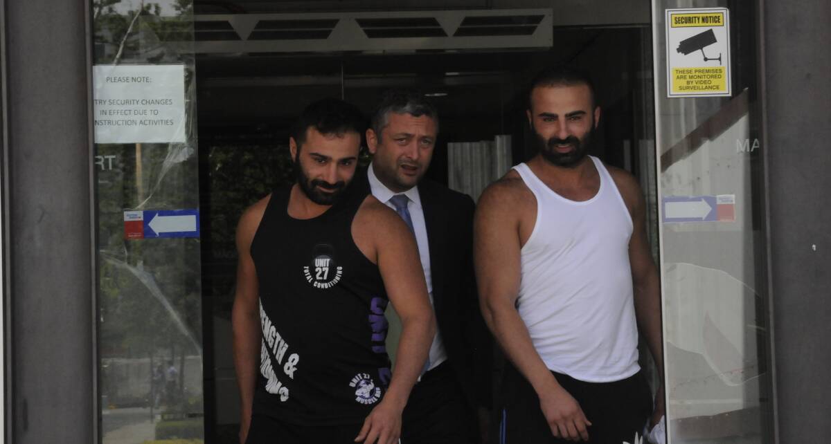 Adam Jabal (far left) and Youssef Jabal (far right) leaving the ACT Magistrates Court with their lawyer Kamy Saeedi.