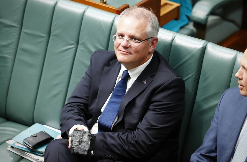 Scott Morrison with a lump of coal in Parliament as treasurer in 2017. Picture: Alex Ellinghausen