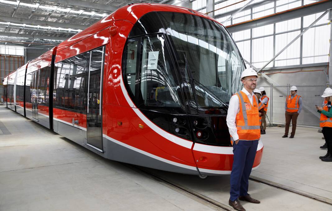 ACT Chief Minister Andrew Barr with Canberra's first light rail vehicle at its depot in Mitchell. Picture: Sitthixay Ditthavong