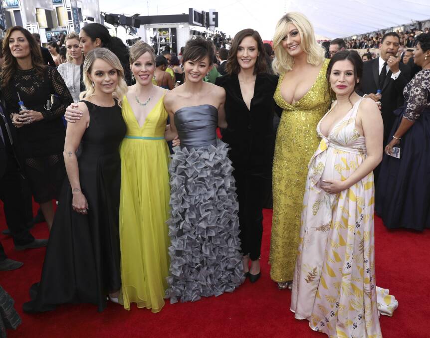 Above: A pregnant Stone with fellow cast members, from left, Taryn Manning, Emma Myles, Kimiko Glenn, Julie Lake and Francesca Curran. Picture: Matt Sayles