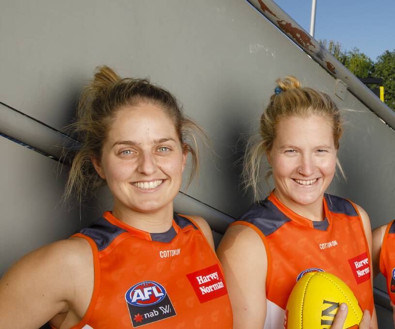 GWS Giants' Ellie Brush, left, and Britt Tully have re-signed with the team. Photo: Sitthixay Ditthavong