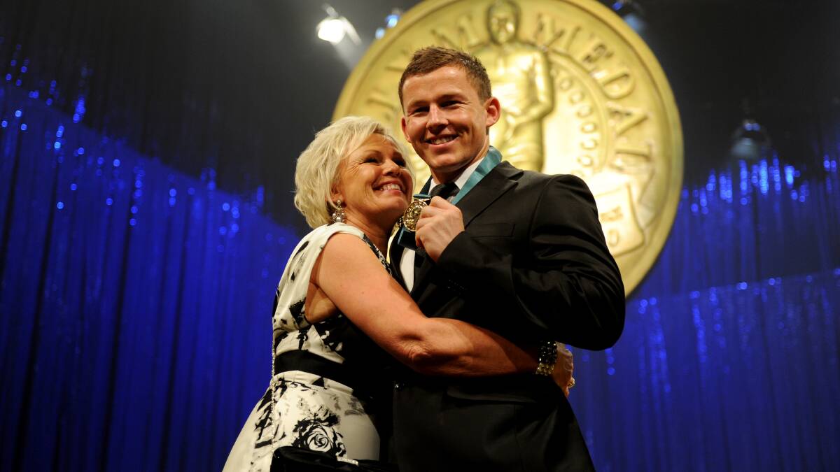 Todd Carney is hugged by his mother Leanne Carney after accepting the Dally M Medal in 2010. Picture: AAP