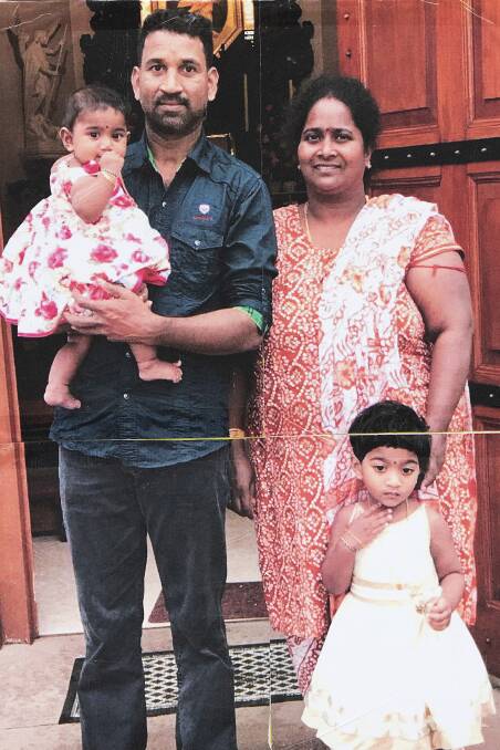 A family portrait of Sri Lankan Tamils Priya and Nadesalingam and their two Australian-born children, Kopika and Tharunicaa, from Biloela in Queensland. Picture: AAP